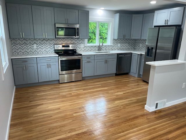 Grey shaker kitchen with stainless appliances